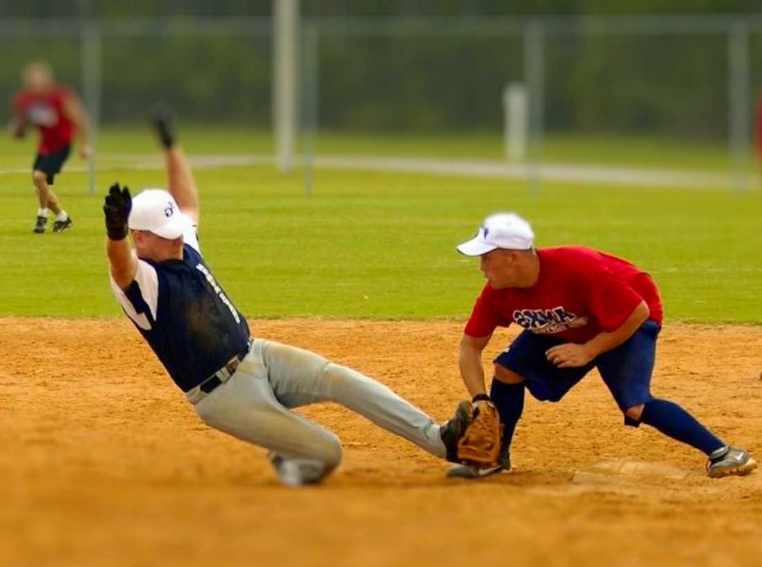 Softball action - He's OUT !